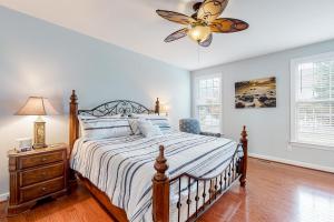 a bedroom with a bed and a ceiling fan at Millville by the Sea --- 23772 Pembroke Lane in Millville +31 photos
