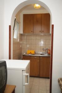 a kitchen with a sink and a counter top at Studio Mali Losinj 7953a in Mali Lošinj