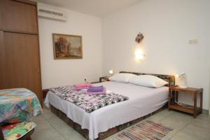a bedroom with a bed in a room at Studio Mali Losinj 7953b in Mali Lošinj