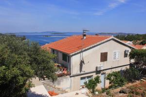 a house with a view of the water at Apartments by the sea Zaglav, Dugi otok - 8191 in Sali