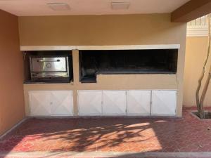 a garage with a toaster oven on a wall at Morada Luminosa - San Juan, Capital in San Juan