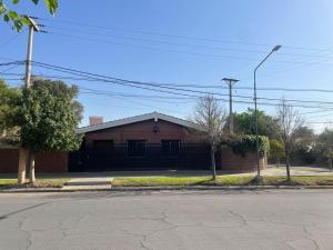 an empty street in front of a brick building at Morada Luminosa - San Juan, Capital in San Juan