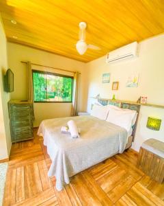 Postel nebo postele na pokoji v ubytování Casa aluguel Abraão ilha grande 4,Ar