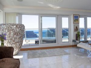 a living room with a view of the ocean at The Penthouse - Clearview in Newquay