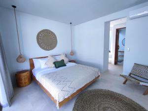 a bedroom with a large bed in a room at Kalea Villas in Kuta Lombok