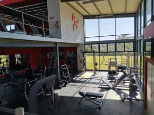 a gym with cardio equipment in a building at Langebaan Golf Studio A1 - Langebaan Golf Estate in Langebaan