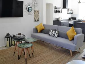 a living room with a blue couch and two tables at Merrick - Uk34536 in Newton Stewart