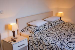 Postel nebo postele na pokoji v ubytování Green Park Apartments