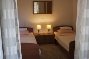 Postel nebo postele na pokoji v ubytování Green Park Apartments