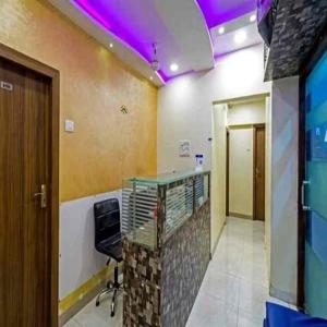 an office with a desk and a chair in a room at Hotel New Sarah Inn, Andheri West in Mumbai