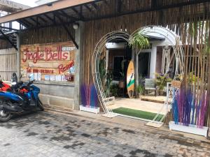 a scooter parked in front of a store at Jingle Bells Resort in Ko Larn