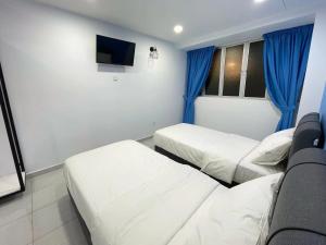 Postel nebo postele na pokoji v ubytování Gemilang Hotel Klang
