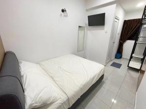 Postel nebo postele na pokoji v ubytování Gemilang Hotel Klang