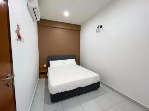 Postel nebo postele na pokoji v ubytování Gemilang Hotel Klang