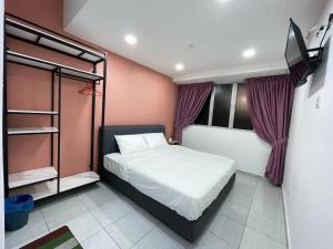 Postel nebo postele na pokoji v ubytování Gemilang Hotel Klang