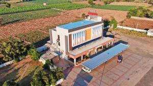 an overhead view of a building in a field at Hotel Narmada in Lāchharas