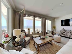 a living room with a couch and a table at Sea Glass #201 in Gulf Shores