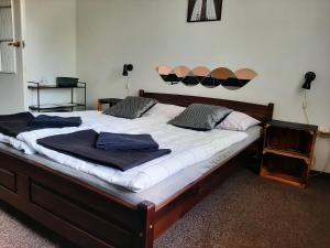 Postel nebo postele na pokoji v ubytování Hotel Olimpijski