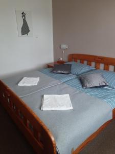 Postel nebo postele na pokoji v ubytování Hotel Olimpijski