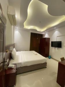Voodi või voodid majutusasutuse ALJAWHARA INN HOTEL toas