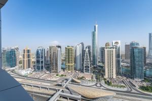 a view of a large city with tall buildings at Dubai Marina - Stunning Huge 4 Bedroom Apts Near JBR - Gym - Pool - Parking by Sojo Stay in Dubai