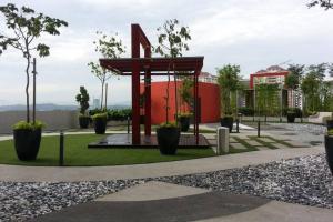 a pavilion in a park with trees and plants at Newly Painted 3-Room Residence, Near IOI City Mall, UPM, UNITEN, IUKL in Kajang