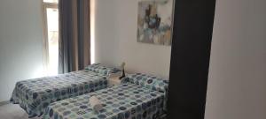 Posteľ alebo postele v izbe v ubytovaní Malaguetor Home Colón