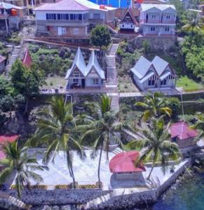 an aerial view of a house with palm trees at Vandu's View Guest house & Restaurant in Tuk Tuk
