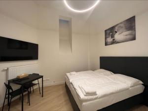 Posteľ alebo postele v izbe v ubytovaní Figaro Suites