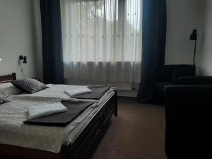 Postel nebo postele na pokoji v ubytování Hotel Olimpijski
