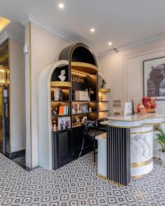a dressing room with a table and a counter at Padona Hotel in Da Lat