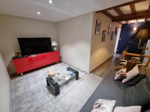 an overhead view of a living room with a flat screen tv at CASA ALTEA in La Chapelle-de-Guinchay