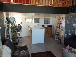 a kitchen with a counter and a sink in a room at La Casa De La Ciotat in La Ciotat