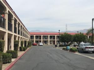 an empty street in front of a building at Howard Johnson by Wyndham Azusa in Azusa