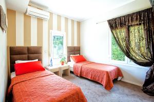A bed or beds in a room at Anastassiou Hotel - Bike and motorcycle friendly hotel
