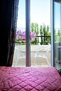 A balcony or terrace at Anastassiou Hotel - Bike and motorcycle friendly hotel