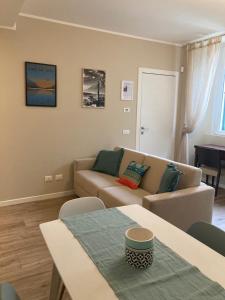 a living room with a couch and a table at SilverHome in Lecco