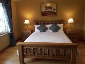 Postel nebo postele na pokoji v ubytování Doonard Manor B&B
