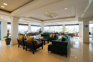 a large lobby with couches and tables and chairs at Hotel Giannoulis in Paralia Katerinis