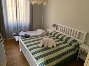 A bed or beds in a room at La Casetta del Flaminio a Roma Centro