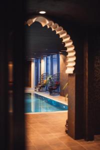 a view of a swimming pool in a building at Lily Country Club in Klofta