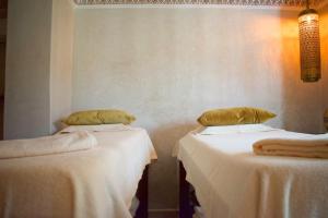 Postel nebo postele na pokoji v ubytování Perlekech Riad & Spa
