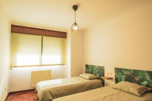 Posteľ alebo postele v izbe v ubytovaní Apartmento Alcabre (Vigo) vistas al mar 6 personas