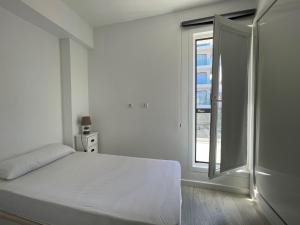 Posteľ alebo postele v izbe v ubytovaní Oasis Club A
