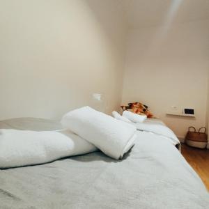 two white pillows on a bed in a room at SWEET HOME BILBAO in Bilbao