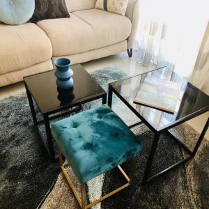 a living room with a couch and a table and a chair at CHARMING APARTMENT NEAR THE BEACH in Villefranche-sur-Mer