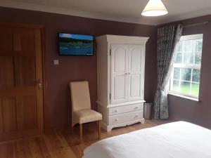 Postel nebo postele na pokoji v ubytování Doonard Manor B&B