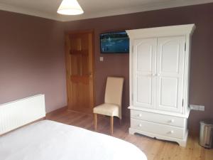 Postel nebo postele na pokoji v ubytování Doonard Manor B&B