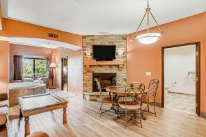 a living room with a table and a fireplace at Chula Vista Condo Unit 2645 in Wisconsin Dells