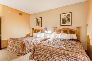 a hotel room with two beds in a room at Chula Vista Condo Unit 2645 in Wisconsin Dells